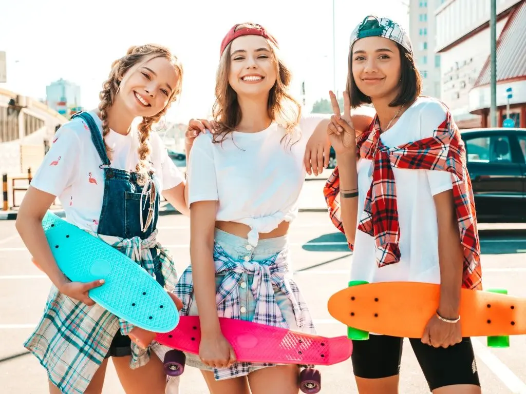 three-young-smiling-beautiful-girls-with-colorful-penny-skateboards.jpg